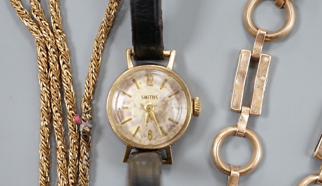 A 9ct bracelet, a 9kt necklace, 11.5 grams, and a lady's 9ct gold Smiths, manual wind wrist watch, on a leather strap, gross 9.2 grams.